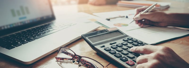 Close,Up,Businessman,And,Partner,Using,Calculator,And,Laptop,For Close,Up,Businessman,And,Partner,Using,Calculator,And,Laptop,For